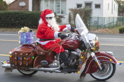 Santa Rides Indian Motorcycle to Deliver Christmas Gifts to Orphans