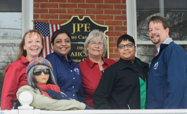 DOYLESTOWN, PA -  FEBRUARY  19: Staff members at At Home Certified Senior Healthcare pose with Marge the Mannequin on the porch February 19, 2014 in Doylestown, Pennsylvania. (Photo by William Thomas Cain/Cain Images)