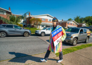 Pierre Robert Places Signs On Front Line Workers Lawn